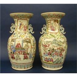 PAIR OF FAMILLE ROSE PORCELAIN VASES, Chinese. 19th Century. Each decorated with figural panels...