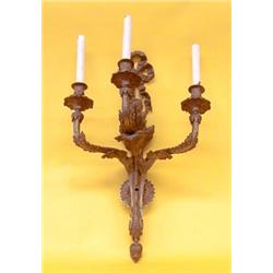 SET OF FOUR LOUIS XV STYLE GILT BRONZE THREE LIGHT SCONCES, Each leaf and ribbon back plate sup...