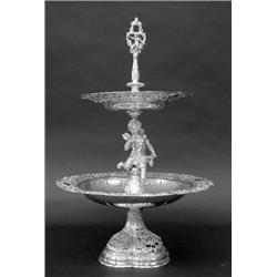 CONTINENTAL SILVER TWO TIER DESSERT STAND, German. Circa 1900. (.800 Fine) The shaped domical b...