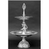 Image 1 : CONTINENTAL SILVER TWO TIER DESSERT STAND, German. Circa 1900. (.800 Fine) The shaped domical b...