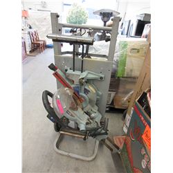 Used Rigid compound saw on rolling base