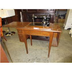 Vintage Singer sewing machine on stand.