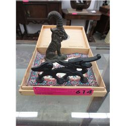 2 Cast metal ornaments