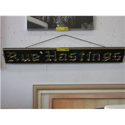 Used carved sign "Rue Hastings"