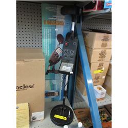 Used metal detector with original box.