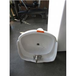 Porcelain pedestal sink with faucet