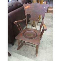 Vintage wood rocker with embossed leather seat