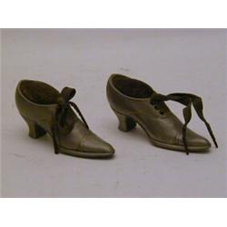 A PAIR OF PEWTER PINCUSHIONS, c.1890, shaped as ladies Oxford shoes, length 9cm (2)  30-40...