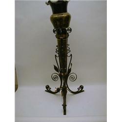 AN ART NOUVEAU WROUGHT IRON CONSERVATORY STAND, whip lash tendrils, containing a damaged ceramic ...