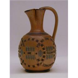 A DOULTON LAMBETH EWER, late 19th Century, caramel colour, impressed convivial epithats, initiall...