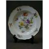 Image 1 : A CABINET PLATE, 19th Century, polychrome floral sprays, gilt rim, Meissen crossed swords mark to...