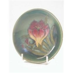 A MOORCROFT TRINKET DISH, tube-lined flower, impressed mark, diameter 11cm  20-40...