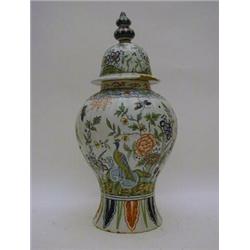 A TIN GLAZED EARTHENWARE BALUSTER JAR AND COVER, polychrome floral and insect decoration, height ...