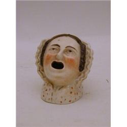 A PRATTWARE INK WELL, c.1830, female head with open mouth, typical on glaze enamels, height 9cm  ...