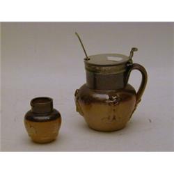A SALTGLAZE STONEWARE MUSTARD POT, sprigged Bacchus decoration, metal mount, impressed 'H' height...