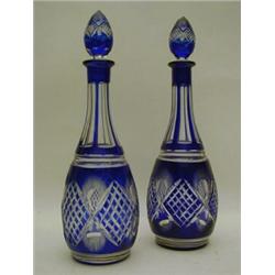 A PAIR OF BLUE FLASHED GLASS DECANTERS, and stoppers, height 37cm (2)  30-50...