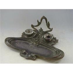 AN ART NOUVEAU METAL DESK STAND, early 20th Century, in the manner of WMF (unmarked), of stylized...