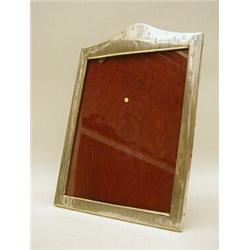 A SILVER MOUNTED EASEL PHOTOGRAPH  FRAME, 25cm x 20cm opening, engraved fleur de lys, Birmingham ...