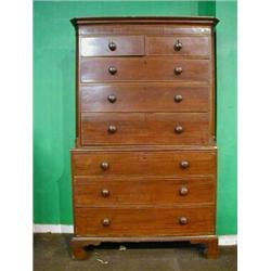 A Georgian mahogany chest on chest with moulded cornice and canted corner, the upper section fitt...