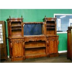 A Victorian amboyna wood sideboard with raised mirrored back flanked by 2 niches fitted shelves,...