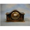 Image 1 : A 1920's striking mantel clock with silvered dial, Roman numerals contained in an arched chinoise...