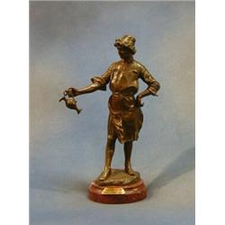 Kossowski, a bronze figure of a standing Inn Keeper, raised on a circular red veined marble base,...