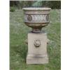 Image 1 : A 19th Century carved stone garden urn with niched and floral decoration, raised on a square base...