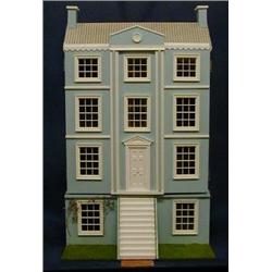 A blue painted dolls house in the Georgian manner with decorated interior, hinged doors etc £150-...