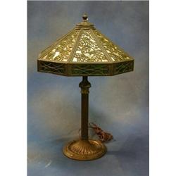 A 1930's Liberty style bronze table lamp (cracks 2 panels) £500-800...