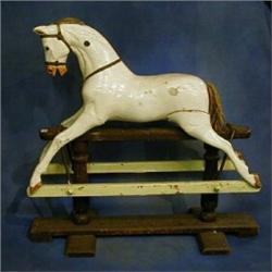 A Victorian wooden rocking horse (F) £150-200...