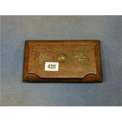 A WWI wooden Trench Art Trinket box with hinged lid decorated 2 Machine Gun Corps cap badges and...