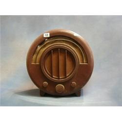 An Art Deco Echo type AD65 radio contained in a round Bakelite case £15-25...