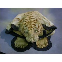 A tiger skin by Van Ingen & Van Ingen with khaki back cloth (some wear) £250-350...