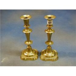 A pair of 18th/19th Century brass candlesticks with shaped bases 10" £50-75...