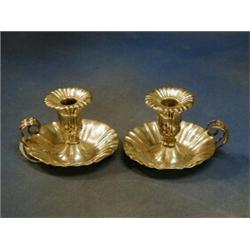 A pair of Continental silver chamber sticks, 7 ozs £200-250...