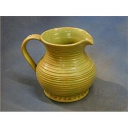 A Burtonware green glazed Art Pottery jug, the base impressed Burton BR 7" £55-75...