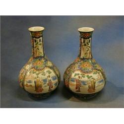A pair of 19th Century famille vert bottle vases decorated court figures 11" £70-90...
