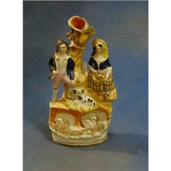 A 19th Century Staffordshire flat back arbour group of lady and gentleman with swans (f) 9" £20-3...