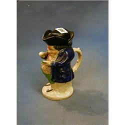 A 19th Century lidded Staffordshire Toby jug in the form of Toby Philpot taking snuff 7" £20-30...