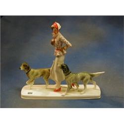 An Art Deco Continental porcelain figure of a lady with 2 dogs, the base impressed 27, raised on...