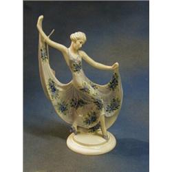 An Art Deco Continental porcelain figure of a dancing lady raised on a circular base 13" £20-30...