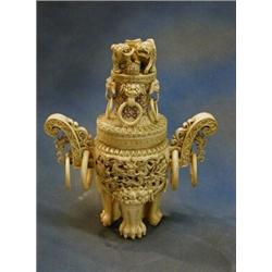 An Eastern pierced ivory twin handled urn and cover 14" £275-350...