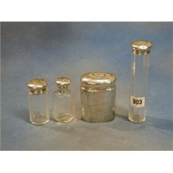 A planished silver oval dressing table jar London 1912, a cut glass pin jar with silver top and 2...