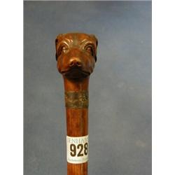 A Victorian carved walking stick the handle in the form of a dogs head £50-75...