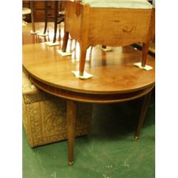 Oval two leaf extending dining table with two…