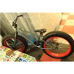 MOOSE BIKE WITH OVERSIZED TIRES (ONE IS FLAT)