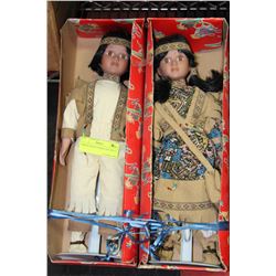 PAIR OF PORCELAIN NATIVE DOLLS