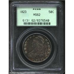 1823 50C MS62 PCGS. O-111a, R.2. The obverse has deep lavender patina with peripheral hints of orang