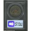 Image 2 : 1887 50C PR65 PCGS. Mottled olive-orange toning fades to medium gray patina over much of the reverse