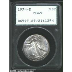 1934-D 50C MS65 PCGS. Steel-blue and iridescent mauve colors paint the surfaces of this sharply stru